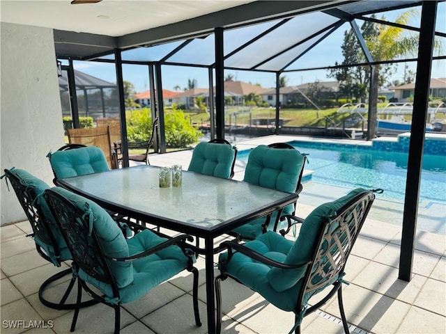 view of patio / terrace with a lanai