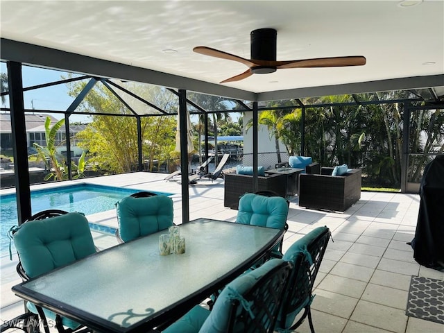 view of patio / terrace with outdoor lounge area, ceiling fan, and glass enclosure