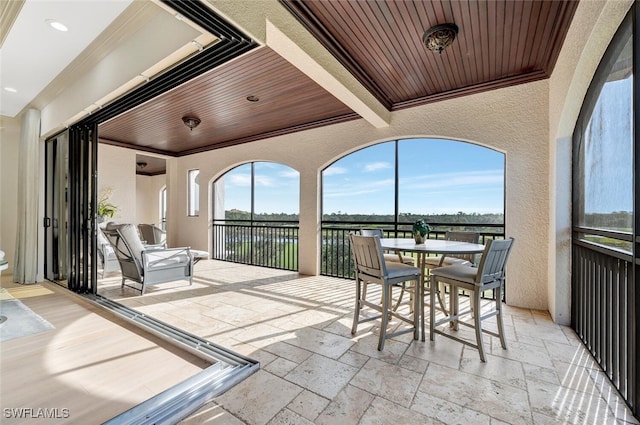 sunroom / solarium with wooden ceiling