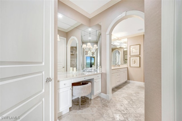 bathroom with vanity and ornamental molding