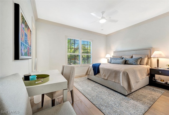 bedroom with ceiling fan, hardwood / wood-style flooring, and crown molding