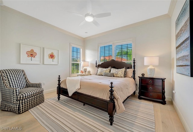 bedroom with crown molding, light wood-type flooring, and ceiling fan