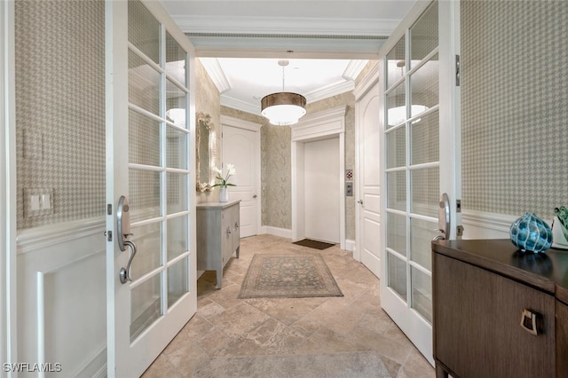 entryway with french doors and crown molding