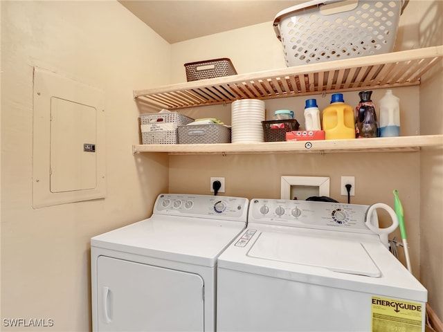 clothes washing area featuring separate washer and dryer and electric panel