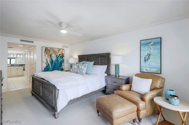 bedroom featuring ensuite bathroom, ceiling fan, light tile patterned floors, and visible vents