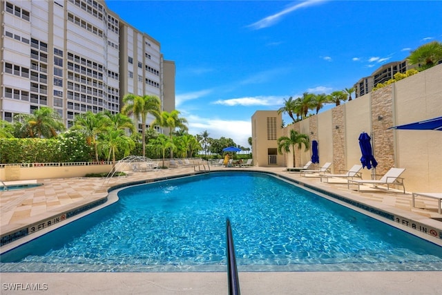 pool featuring a patio area