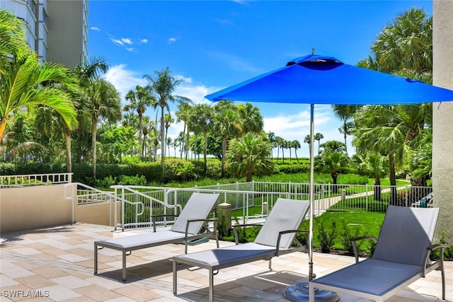 view of patio featuring fence