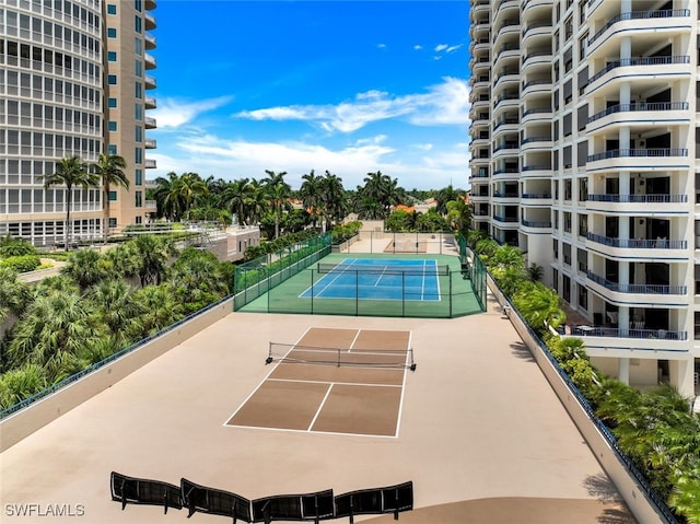 view of sport court featuring fence