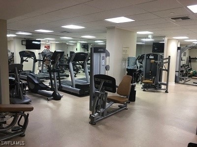 gym featuring a drop ceiling and visible vents