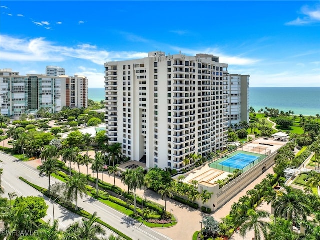 view of property featuring a water view and a city view