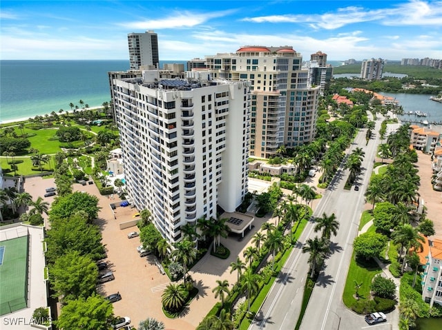 drone / aerial view featuring a water view and a view of city