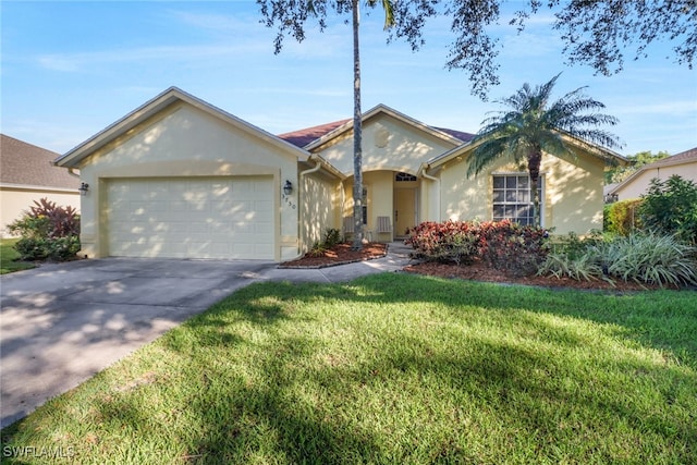 ranch-style home featuring a front lawn and a garage