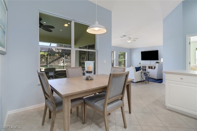 dining space featuring plenty of natural light, light tile patterned flooring, and ceiling fan