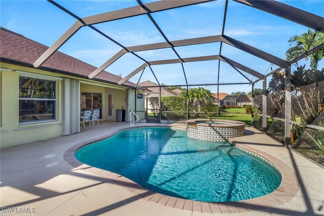 view of swimming pool with glass enclosure, an in ground hot tub, and a patio