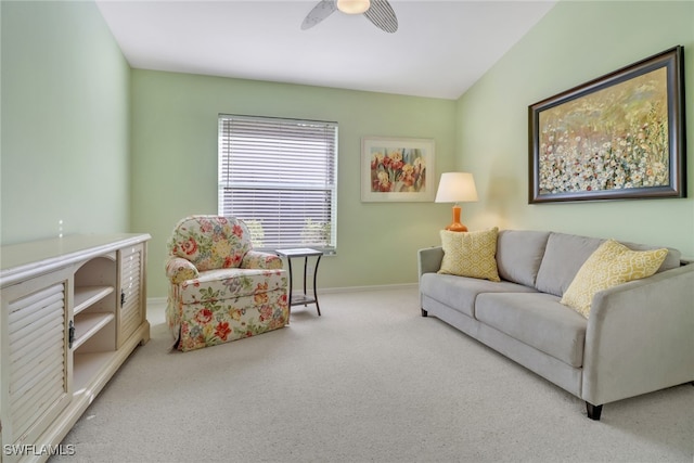 carpeted living room with lofted ceiling and ceiling fan