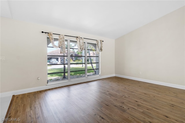 empty room featuring dark hardwood / wood-style flooring