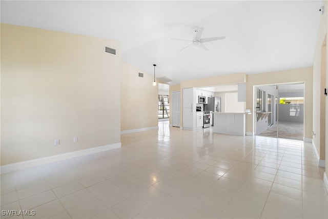 unfurnished living room featuring ceiling fan, light tile patterned flooring, and lofted ceiling