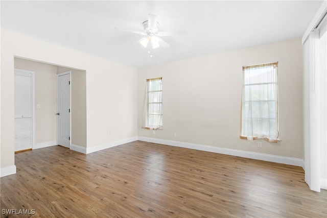 spare room with ceiling fan and light hardwood / wood-style flooring