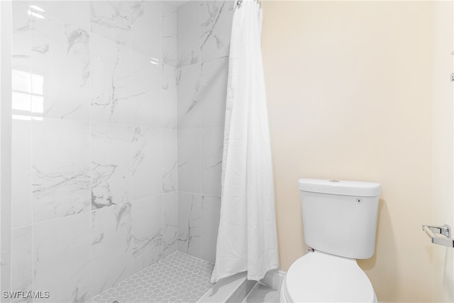 bathroom with toilet and walk in shower