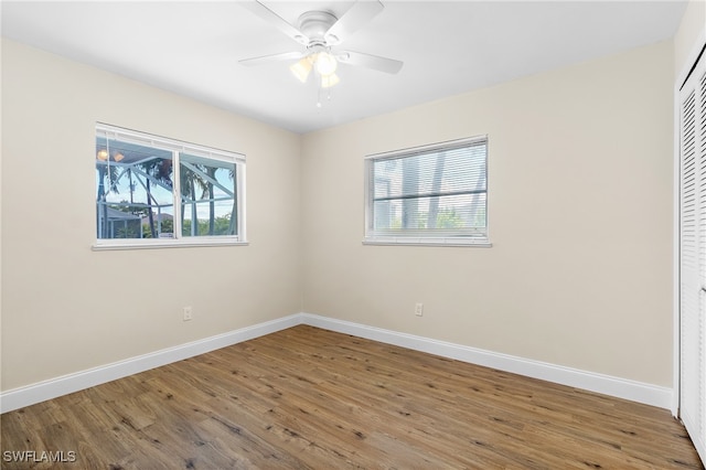 unfurnished room featuring ceiling fan and hardwood / wood-style floors