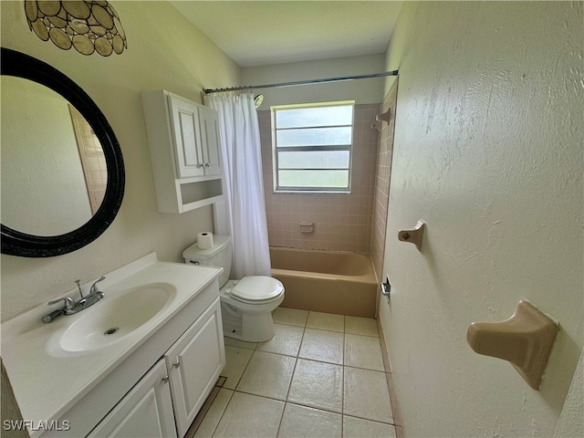 full bathroom with tile patterned flooring, toilet, shower / tub combo with curtain, and vanity