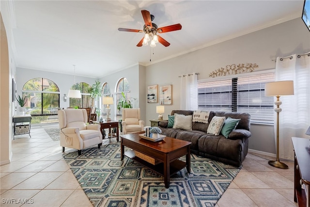 living room featuring ornamental molding, light tile patterned floors, and ceiling fan