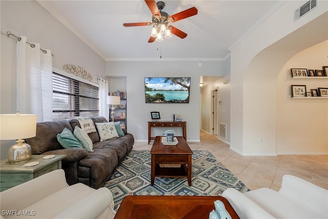 living room featuring ceiling fan, crown molding, and light tile patterned flooring