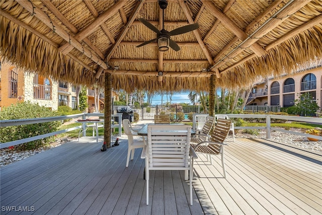 wooden terrace with ceiling fan and a gazebo