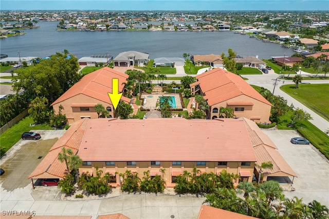 birds eye view of property featuring a water view