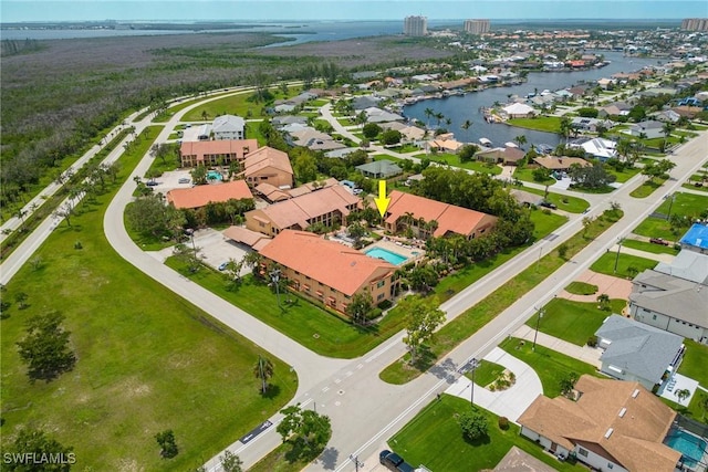 birds eye view of property featuring a water view and a residential view