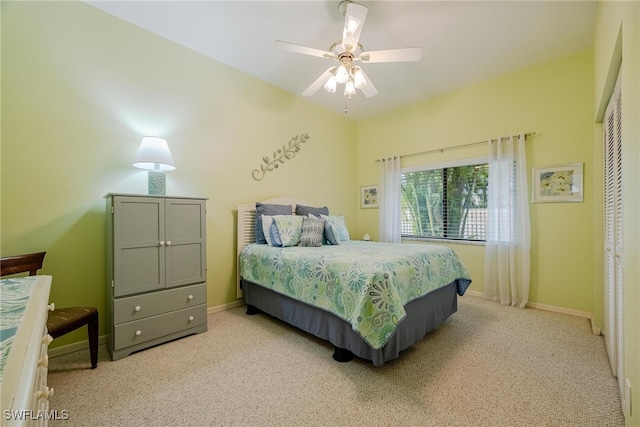 carpeted bedroom featuring a closet and ceiling fan