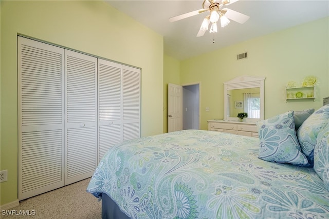 carpeted bedroom featuring lofted ceiling, a closet, and ceiling fan