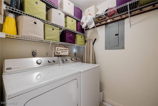 washroom featuring electric panel and washer and dryer