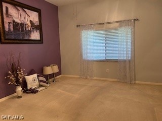 unfurnished room featuring carpet flooring