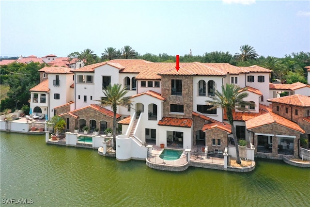 dock area featuring a water view and a patio area