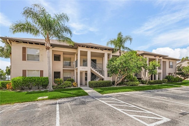 view of property with uncovered parking