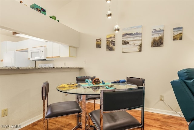 dining space featuring light hardwood / wood-style floors