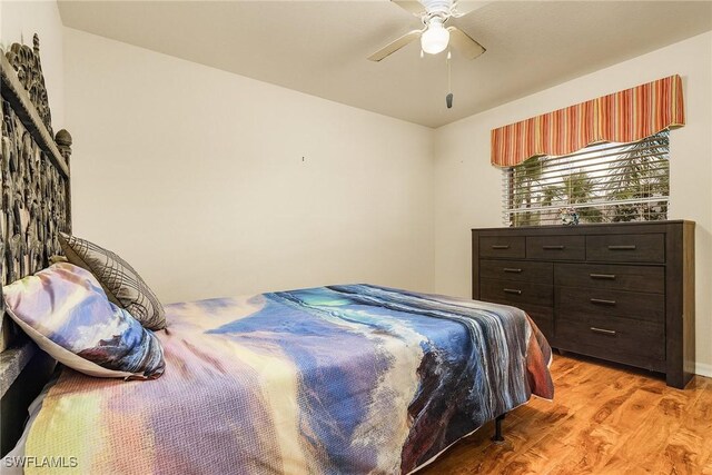 bedroom with light hardwood / wood-style flooring and ceiling fan