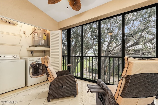 laundry area with washing machine and dryer, light tile patterned floors, and ceiling fan