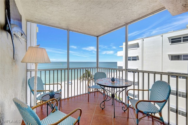 1919 Gulf Shore Blvd N Unit 603, Naples, FL 34102 - sunroom / solarium featuring a water view