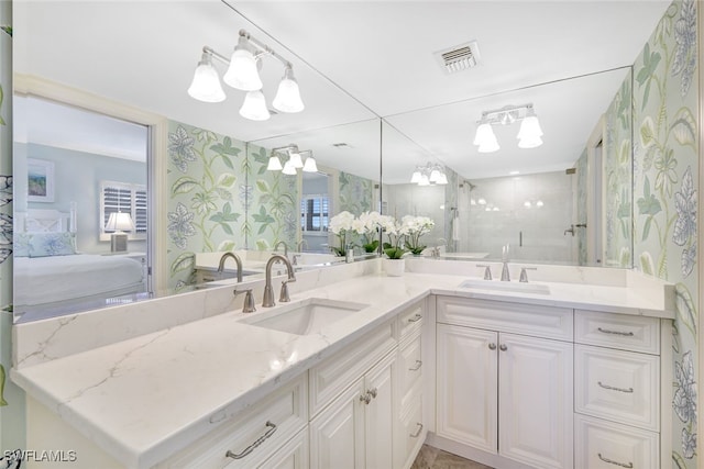 1919 Gulf Shore Blvd N Unit 603, Naples, FL 34102 - ensuite bathroom with a chandelier, double vanity, and a stall shower