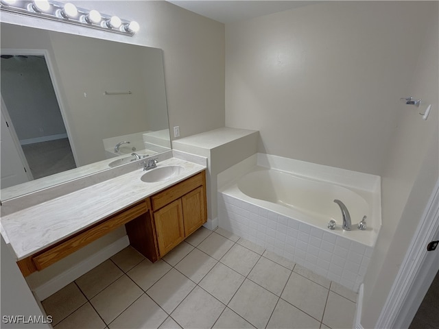 bathroom with vanity, tiled bath, and tile patterned floors