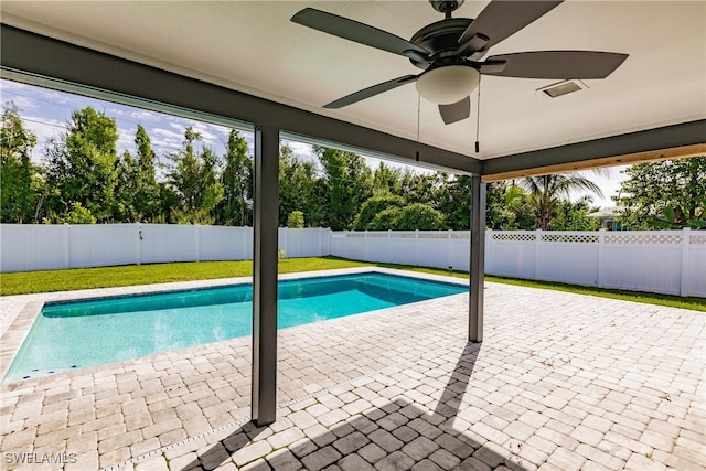 view of swimming pool with ceiling fan, a patio, a fenced backyard, and a fenced in pool