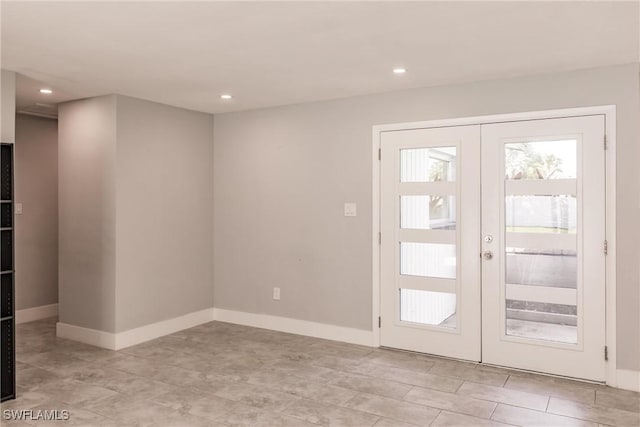 doorway featuring recessed lighting, baseboards, and french doors