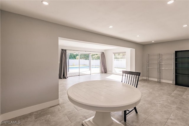 dining area with recessed lighting and baseboards