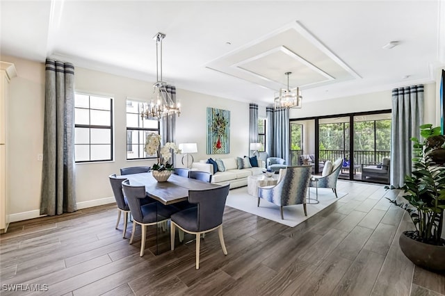 dining room featuring wood-type flooring and plenty of natural light