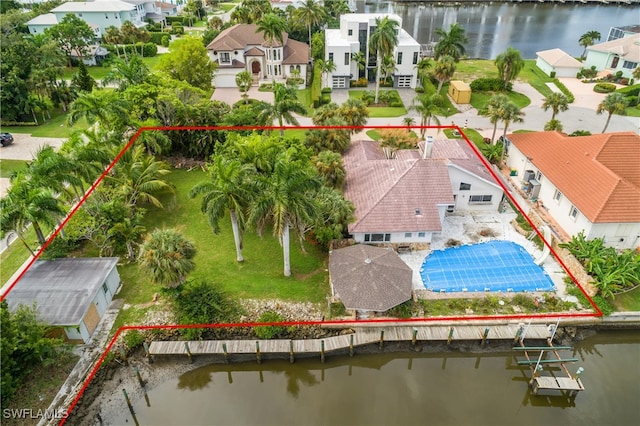 birds eye view of property featuring a water view