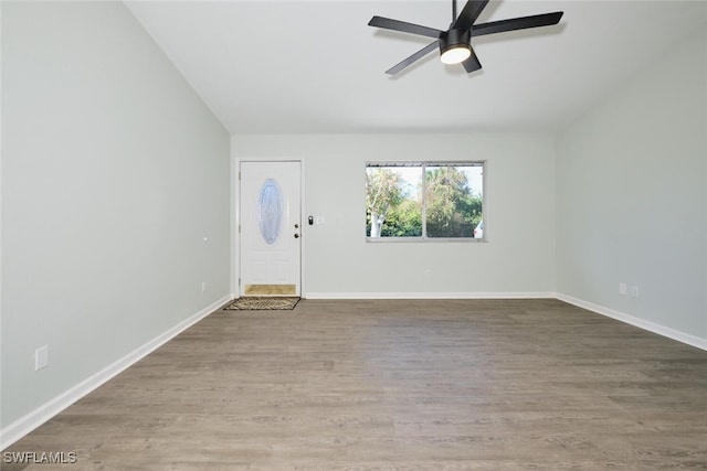 foyer with hardwood / wood-style flooring and ceiling fan