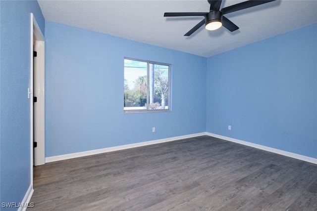 unfurnished room with dark hardwood / wood-style floors and ceiling fan