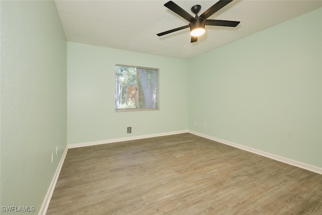 empty room featuring hardwood / wood-style flooring and ceiling fan